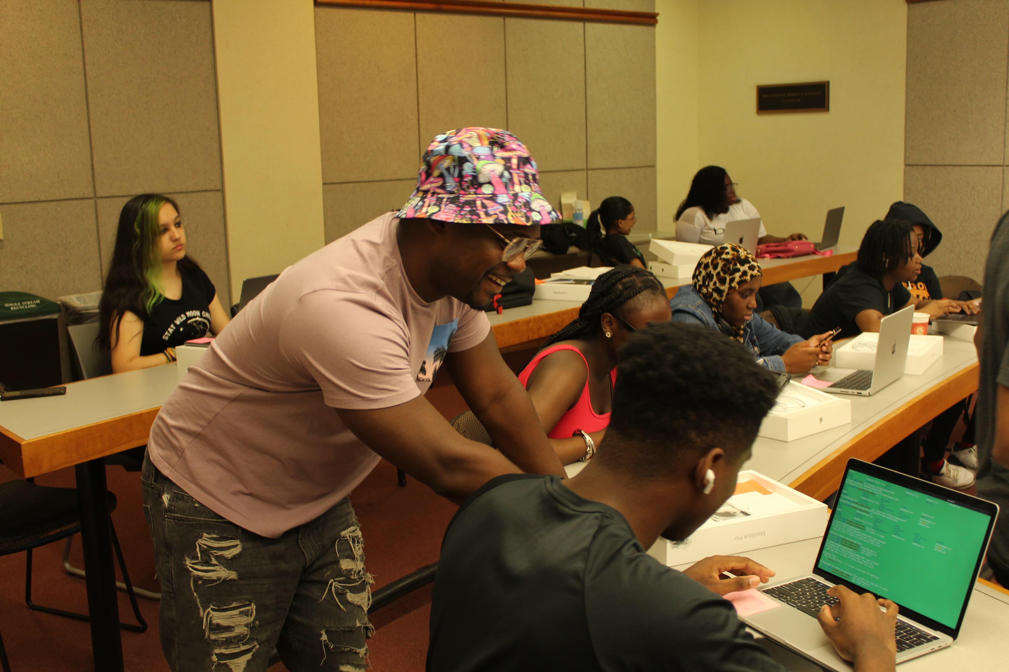 Students working together on coding projects